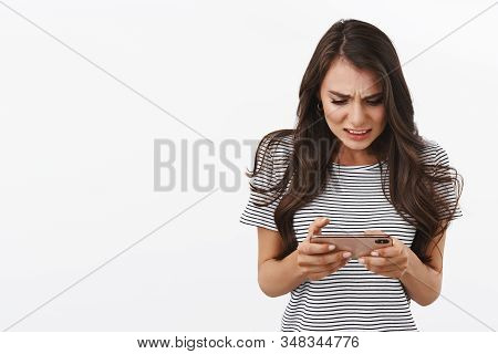 Pressured And Worried, Intense Modern Woman Playing Difficult Game, Clenching Teeth, Frowning And St