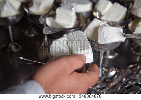 White Ice Cream In Metal Ware In The Tray. Selective Focus. Stainless Ice Cream Cup That Arrange In 