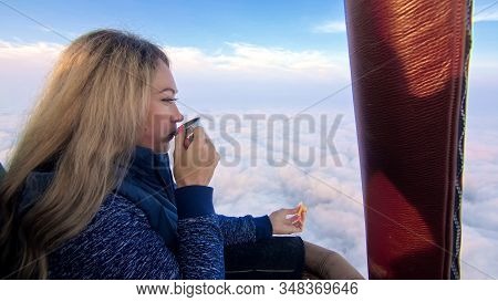 Woman Eat Sandwich And Drinks Tea And Coffee In Flight. Adventure On Hot Air Balloon. Fly In Morning