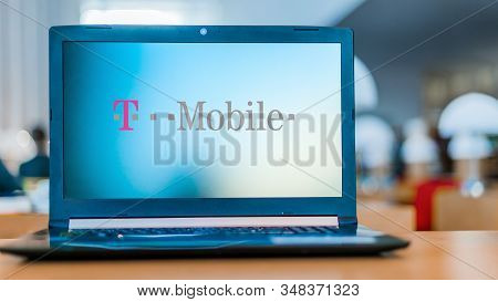 Poznan, Pol - Dec 11, 2019: Laptop Computer Displaying Logo Of T-mobile,  The Brand Name Used By The