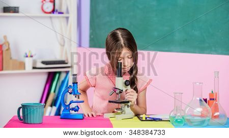 Girl Biology Class Testing Tubes. Science Lesson. School Laboratory. Small Girl With Microscope. Sci