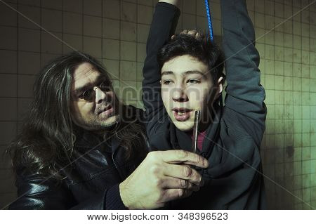 Violent Kidnapper Have Bonded Hanging Young Man Under Control