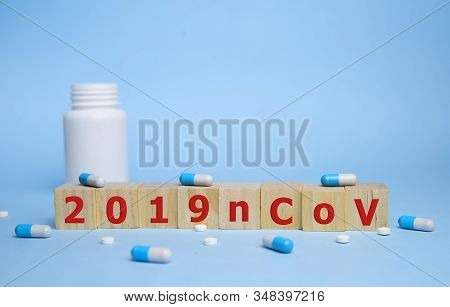 The Inscription 2019ncov On Wooden Cubes, Blue Background. Health Concept, Chinese 2019 Virus-ncov.