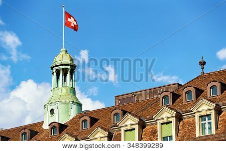 Tower With Swiss Flag And Roof Covered With Tiles Bern