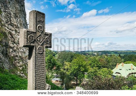 Bran, Romania - September 7, 2017: Medieval Stone Cross With Religious Symbols At The Entrance To Th