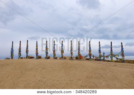 Shamanistic Wooden Ritual Totems With Colorful Ribbons At Cape Burhan, Baikal, Olkhon Island, Siberi