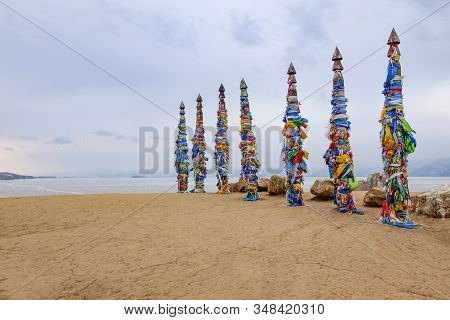 Shamanistic Wooden Ritual Totems With Colorful Ribbons At Cape Burhan, Baikal, Olkhon Island, Siberi