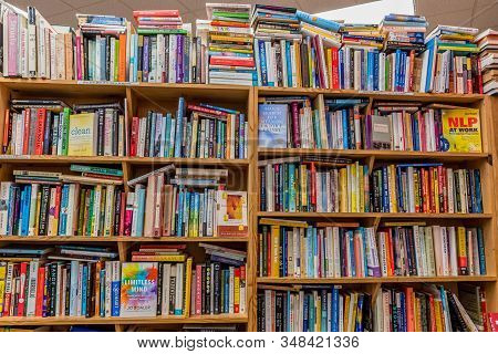 Kailua, Hawaii/usa- Dec. 30, 2019: Piles Of Used Books On Wooden Shelves For Sale In A Used Bookstor