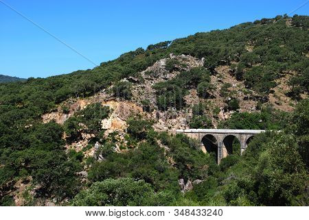 Arched Road Bridge On A Mountain Road, Sierra De Los Alcornocales, Andalucia, Spain
