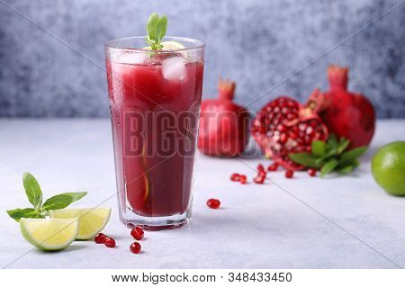 A Cold, Refreshing, Delicious Cocktail Made From Natural Pomegranate Juice, Lime, Mint And Ice Cubes