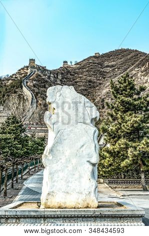 Stone In Front Of A Fragment Of The Great Chinese Wall In The Mountains Near Bejing