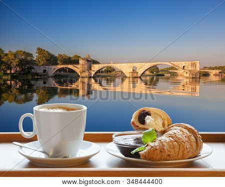 Coffee With Croissants Against Avignon Old Bridge In Provence, France