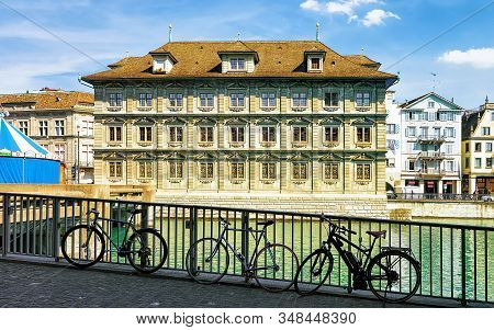 Bicycles At Old Town Hall In River Limmat In Zurich