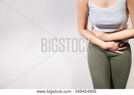 Young Beautiful Woman Having Painful Stomachache. Chronic Gastritis. Abdomen Bloating Concept. Medic