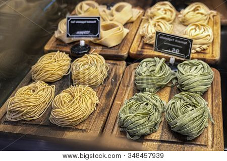 Closeup Of Raw Fresh Homemade Green Pasta Tagliatelle. Fresh Italian Traditional Raw Pasta On The Co