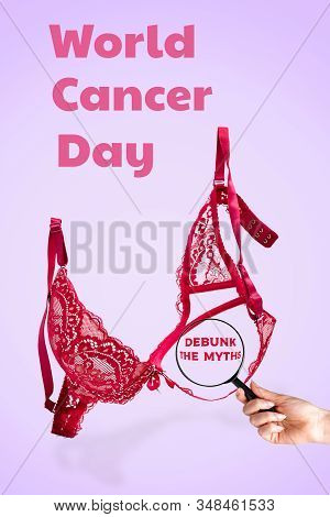 World Cancer Day. Pink Lace Bra On A Lilac Background And A Womans Hand With A Magnifying Glass. Ver