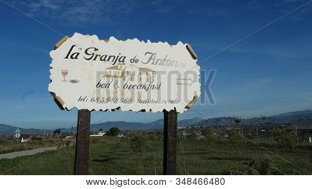 Andalusia, Spain - January 29, 2020: Large Advertising Sign In Andalusian Countryside Pointing To Il