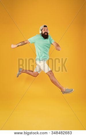 Bearded Guy Enjoy Music. Impetuous Movement. Hipster Dancing Jumping Headphones Gadget. Inspiring So