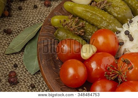 View Of Pickled Pickles. Cucumbers, Diamonds, Cabbage And A Chapel Lie On The Table