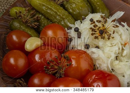 Pickles For A Festive Table. Winter Dish Of Homemade Cucumbers, Tomatoes And Cabbage