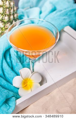 Glass Of Tropical Exotic Multifruit Juice Cocktail Drink On The White Tray With Plumeria Frangipani 