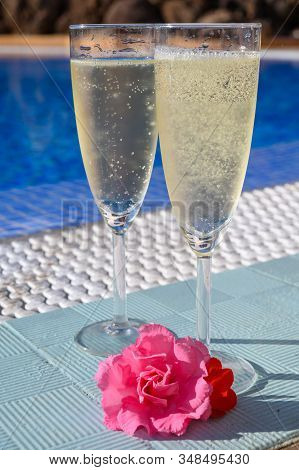 Pool Party With Two Glasses Of Bubbles White Champagne Or Cava Wine, Romantic Event On All Inclusive