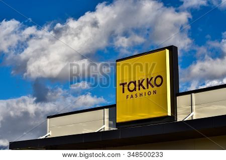 Sfantu Gheorghe, Romania- 02 February 2020: Takko Fashion Street Sign , White Clouds On Blue Sky In 