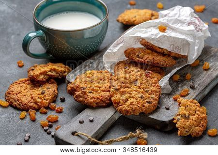 Homemade Oatmeal Cookies With Raisins And Cup Of Milk. Concept Is Healthy Food, Breakfast.