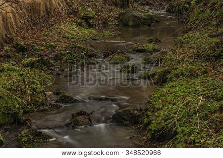 Zvikovsky Creek With Green Grass And Stones Near Velesin Town In South Bohemia
