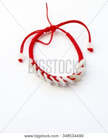 Happy Ethnic Red Thread On A Hand With Jade Coins On A White Background, View From Above,  With Copy