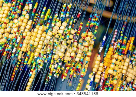 Large Number Of Bright Colored Baubles And Occult Charms Made Of Wood For The Body, Charms For The H