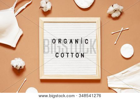 Organic Cotton Concept Flat Lay On The Beige Background With Underwear, Q-tips And Cotton Pads. Top 