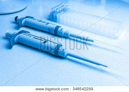 Chemical Equipment Are On The White Background. Automatic Pipettes Eppendorf And Microtube Rack On T