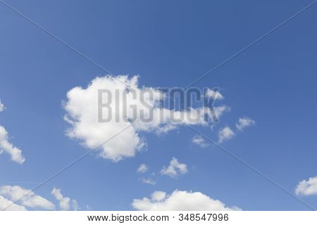 Fluffy Floating White Cloud On A Nastural Blue Sky Background