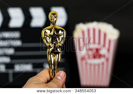 Xalapa, Veracruz, Mexico- January 31, 2020: Woman Hand Holding A Plastic Oscar Award On Blurred Back