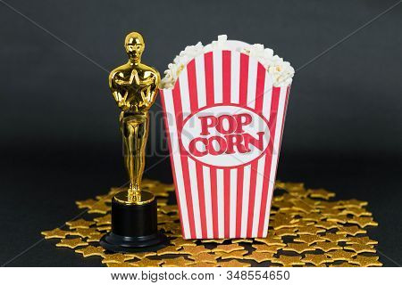 Xalapa, Veracruz, Mexico- January 31, 2020: Classic Popcorn Box, Oscar Award And Golden Stars On Bla