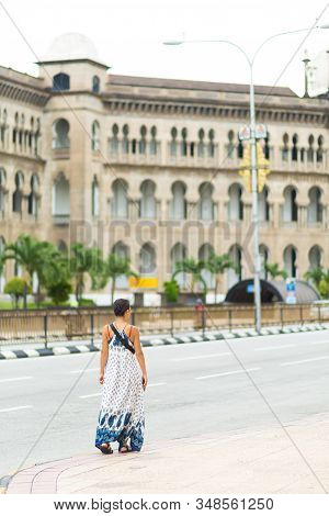 The Kuala Lumpur Railway Station. Malayan Railways Hub. Young Woman Tourist Walk Around Building.