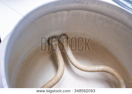 Limescale, Lime Scale On Heating Tank Element, Heater In Old Kettle In Kitchen. A White, Chalky Resi