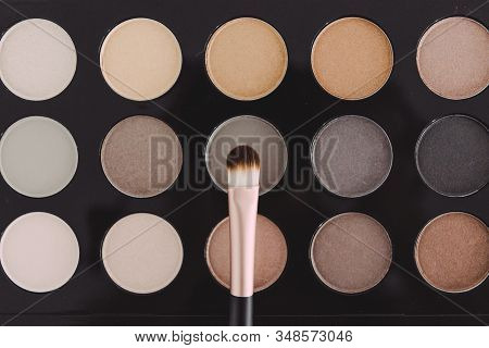 Make-up And Beauty Industry Still-life, Close-up Of Brush On Top Of Eyeshadow Palette With Trendy Nu