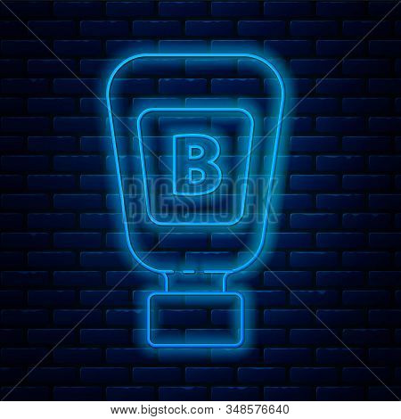 Glowing Neon Line Sauce Bottle Icon Isolated On Brick Wall Background. Ketchup, Mustard And Mayonnai