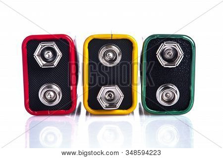 Row Of Nine Volt Battery On White Table Close-up