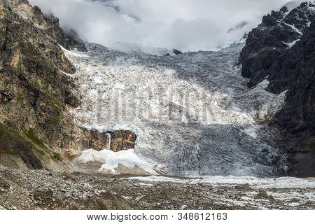 Huge Lardaad Glacier Icefall With Small Waterfall View From Bottom In Mountains Of Svaneti Georgia O