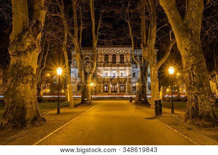 Croatia, City Of Zagreb, Academy Palace Building And Zrinjevac Park In The Night, Long Exposure