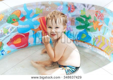 Smiling Boy In The Swimming Infatable Pool, Hello Summer.