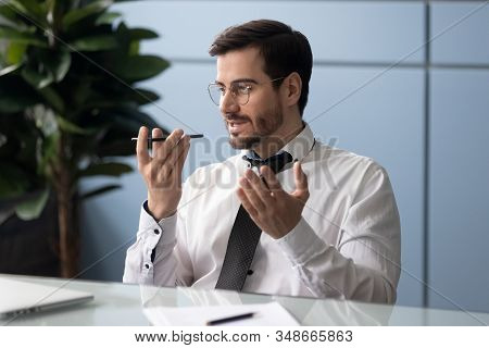 Businessman Holding Smartphone Speaking Through Microphone Sending Voice Message