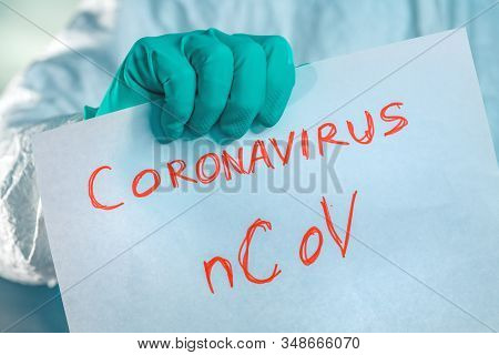 Epidemiologist Holding Coronavirus Bcov Paper Banner In Quarantine, Selective Focus