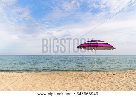 Vacation with shade with umbrella at the beach
