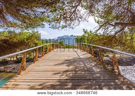 Footbridge In Cala Galdana, A Popular Tourist Resort On The Island Of Menorca. Spain.