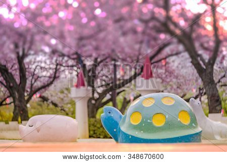 Cute Pig, Turtle And Seal Sculptures Looking At The Cherry Blossoms Of Asukayama Park In The Kita Di