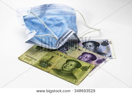 The Concept Coronovirus And Economy Of China Chinese Yuan Money Lie Near Medical Hygiene Mask